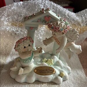 Charming Cherub Figurine with Floral Accents